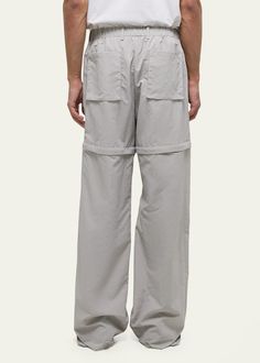 "Find HELMUT LANG Air Nylon Detachable Pants on Editorialist. Helmut Lang utility pants boast exposed cargo pockets and a detachable piece for versatile styling Approx. 33\" inseam Drawstring waistband Side slip pockets; back patch pockets Relaxed fit Full length Nylon Dry clean Imported" Spring Nylon Bottoms With Functional Pockets, Detachable Pants, Utility Pants, Back Patch, Helmut Lang, Drawstring Waistband, Top Brands, Full Length, Dry Clean