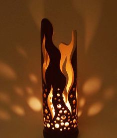 a lit candle holder with flames on it