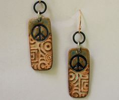 Length: 1 1/2 Handmade pottery bead with galvanized black steel.  Bronze ear-wire. Lightweight: 3 grams Have a little peace in your life :) Witch Jewelry, Hippie Earrings, Ceramic Earring, Hippie Jewelry, Vibe Clothes, Jewelry Outfit, Funky Jewelry, Wedding Jewelry Earrings, Jewelry Inspo