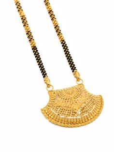 This timeless 3-row 22ct gold Mangal Sutra is crafted with 30.72 grams of gold for a luxurious finish. Expertly crafted with intricate detail, this necklace is a stunning way to express your commitment. Purity: 22ct gold Length: 72 cm + 3.3 cm (pendant) Dual-tone Yellow Gold Jewelry For Diwali, Diwali Dual-tone Yellow Gold Jewelry, Yellow Gold Dual-tone Jewelry For Festivals, Gold Necklace With Intricate Design For Puja, Fusion Style Yellow Gold Jewelry For Puja, Festive 22k Gold Dual-tone Necklaces, Fusion Style 22k Yellow Gold Necklace, Fusion 22k Yellow Gold Necklace, Yellow Gold Necklace With Intricate Design For Puja