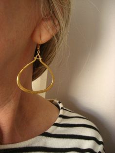 Triangular earrings hoop earrings triangle dangle gold Modern Hammered Earrings For Everyday, Elegant Hammered Brass Teardrop Earrings, Elegant Everyday Triangle Earrings, Modern Hammered Drop Jewelry, Elegant Triangle Everyday Jewelry, Gold Teardrop Hoop Earrings Minimalist Style, Modern Triangle Gold Hoop Earrings, Modern Hammered Drop Hoop Earrings, Minimalist Hammered Drop Earrings