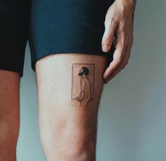 a person with a small tattoo on their leg