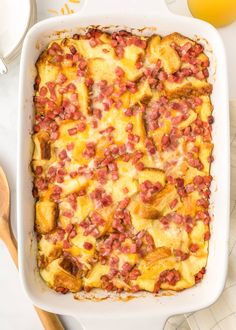 a casserole dish with ham and cheese in it on a white counter top