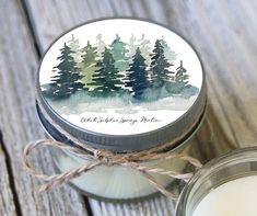 a jar with a candle sitting on top of a wooden table