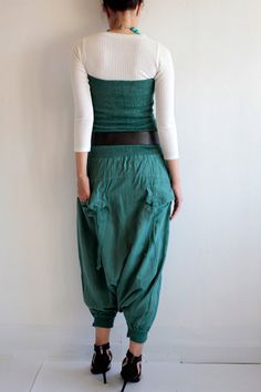 "Our new spring/summer beauty! Beautiful tube top all the way to the waist line. Shirring smock with double layer fabric, not see through. Same design back and front. The bottom part is drop crotch style pants. Roomy. 2 side pockets. 2 back pockets with ties. The bottom part is elastic hem. You can adjust to capris lenght or shorts lenght. Can be worn many ways. 1. Wear as a tube top. 2. Wear as a high waist pants with other top piece. You can also wear inside with a jacket over. with belt or wi Fitted Casual Harem Pants For Spring, Fitted Green Sets With Pockets, Fitted Cotton Harem Pants For Summer, Fitted Summer Harem Pants, Fitted High Waist Harem Pants For Summer, Fitted High Waist Summer Harem Pants, Fitted Full-length Harem Pants For Spring, Fitted Full Length Harem Pants For Spring, Green Harem Pants For Spring