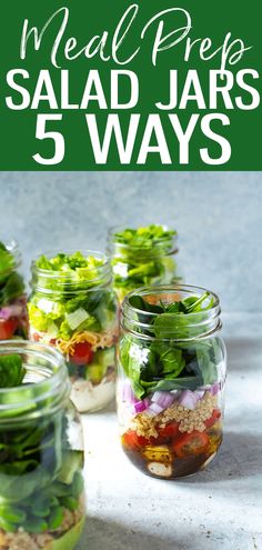 several mason jars filled with salads and vegetables