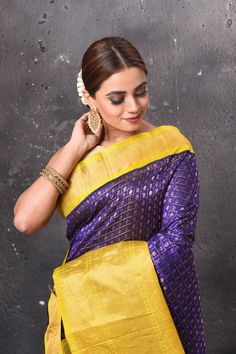 Look elegant on festive occasions in this beautiful purple zari work Kanjivaram silk sari. The saree has a yellow zari border and pallu . It comes with a matching blouse piece. Shop Kanchipuram sarees in USA from Pure Elegance Indian saree store in USA. Disclaimer: The shown stitched blouse on the model is for display purpose only. The saree comes with a matching blouse piece and finished with fall and piko. Purple Handloom Pre-draped Saree For Puja, Purple Handloom Pre-draped Saree For Diwali, Bollywood Style Purple Handloom Pre-draped Saree, Purple Self-design Pre-draped Saree For Puja, Purple Tussar Silk Saree With Meenakari, Purple Meenakari Tussar Silk Saree, Designer Purple Meenakari Dupatta, Purple Pre-draped Saree For Puja And Diwali, Purple Pre-draped Saree For Diwali Puja