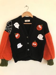 Welcome to my boutique. All cardigans are 100% handmade. You can order a cardigan in any size and model you want (cloud cardigan, strawberry cardigan, donut cardigan, etc.) 3D pumpkin buckle is a gift The sleeves of the cardigan look like pumpkins Note: You can send a message for child size or different color 📧 *100% Handmade *100% High quality wool * Perfect fit for different body types and sizes * Stylish, keeps you very warm *You can request different colors. If you want a different color, p Cute Fitted Cardigan For Autumn, Cute Fitted Fall Cardigan, Cute Black Sweater For Fall, Cute Black Fall Sweater, Cute Black Cardigan For Fall, Playful Knit Cardigan For Fall, Cute Black Long Sleeve Cardigan, Black Long Sleeve Cute Cardigan, Playful Knitted Cardigan For Fall