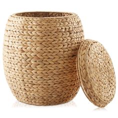 a large woven basket with lid next to it on a white background, isolated for use as a container