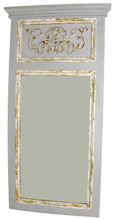 an old white mirror with gold trimmings on the top and bottom edge, against a white background