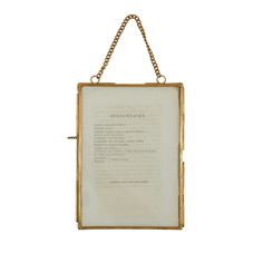 an old book hanging on a chain