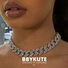 The 16mm Spoiled Cuban Baguette Necklace is an upgraded version of the classy Cuban Link Necklace. Featuring both the round cut and the baguette-shaped prong-set stones. This is a statement piece that will do the talking for you. - Width: 16mm Luxury Diamond Necklace With Baguette Cut Diamonds, Luxury Classic Diamond Necklace With Curb Chain, Luxury Diamond Necklace For Party, Luxury Chain Jewelry For Parties, Elegant Diamond Jewelry With Chunky Chain, Trendy Silver Iced Out Jewelry, Luxury Silver Rhinestone Necklace With Cubic Zirconia, Elegant Cuban Link Chain Necklace For Parties, Trendy Diamond Jewelry With Bling