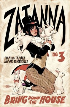 the cover to zatanna, featuring an image of a woman holding two rabbits