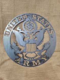 the united states army emblem is shown on a burlocked piece of fabric