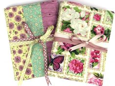 three different colored papers with flowers and butterflies on them