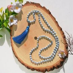 Dig deep within and take charge of your mental and spiritual well-being with this 108 Aquamarine Beads Mala. Wearing or holding an Aquamarine mala reminds you to trust the higher spiritual powers of the universe and let yourself go with the flow. Malas are beautiful tools to work with in meditation and prayer, and even to wear as sacred every-day adornment for deeper contemplation and focus. They’re a powerful way to channel the gemstone energy and transformative power of an ancient divinity. Wo Spiritual Blue Beaded Necklaces For Healing, Spiritual Turquoise Beaded Necklaces For Meditation, Spiritual Mala With 108 Beads For Blessing, Bohemian Mala With 108 Beads For Meditation, Spiritual Blue Necklaces For Rituals, Bohemian Mala With 108 Beads For Blessing, Blue Spiritual Necklaces For Rituals, Bohemian 108 Beads Mala For Blessing, Bohemian Mala With 8mm Beads For Meditation