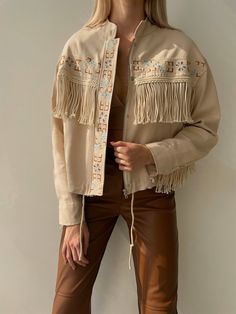 *Product size on mannequin Small, UK:8 - US:6Women's Pure Beige Denim Fringe Jacket * It is the SMALL size on the model. The model's height is 175 and it weighs 55 kilos. * The length of the jacket from the shoulder down is 55 cm. * Regular cut * This jacket is exactly made of Premium denim fabric. has been carefully * We designed and produced with attention to all details. * Perfect Design, professional cut and First class stitching * According to international standards throughout. * Ideal for Beige Festival Outerwear For Spring, Beige Spring Festival Outerwear, Cream Fringe Outerwear For Spring, Spring Long Sleeve Denim Jacket For Rodeo, Bohemian Long Sleeve Outerwear For Rodeo, Spring Cream Outerwear With Fringe, Spring Rodeo Long Sleeve Denim Jacket, Spring Cream Fringe Outerwear, Spring Rodeo Outerwear With Fringe