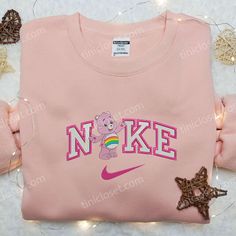 Introducing the Cheer Bear x Nike Embroidered Shirt, a perfect blend of iconic charm and athletic style. Made with premium Cheer Bear, Nike Branding, Bear Character, Nike Shirt, Nike Brand, Athletic Style, Cap Men, Care Bear, Bear Design