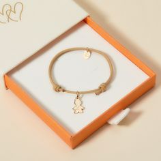 Celebrate your little one with our Children’s Personalized Mini Boy Bracelet. A special keepsake for them to treasure, each bracelet can be personalized to capture your little one’s unique character. Choose between a choice of vibrant braid colours to pair alongside a mini boy charm, hand engraved with their name.18K Champagne Gold Plated, 925 Sterling Silver or 18K Rose Gold PlatedMini Boy:0.47 x 0.31Braid made of a durable, colourfast polyesterFully adjustable sliding knot fasteningHand-engraved in our Paris workshopSent with love in a complimentary gift boxAny slight variations in lettering depth, spacing and alignment from the examples shown are part of the aesthetic and originality of the pieceChildren’s Warning: please note, this piece of jewelry is not a toy. We advise you to not le Customizable Adjustable Charms For Gifts, Customizable Adjustable Charms, Adjustable Customizable Charms For Gifts, Adjustable Nickel-free Charms For Friendship, Cute Charm Bracelet With Removable Charms As Gift, Adjustable Charm Bracelets For Birthday, Adjustable Bracelets With Removable Charms For Friendship, Adjustable Jewelry With Removable Charms For Gifting, Nickel-free Adjustable Charms For Birthday