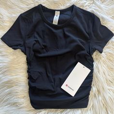 Lululemon All It Takes Tee *Ribbed Nulu Color: Black Size: 2 & 6 Nwt!! Ribbed Short Sleeve Workout Top, Black Ribbed Yoga Top, Black Ribbed Tops For Yoga, Black Ribbed Workout Top, Lulu Lemon Tops, Lulu Shirts, Lulu Lemon Align Tank, Lulu Shirt, Lulu Fits