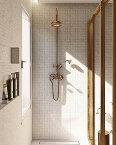 a bathroom with a shower head and hand held shower faucet in the corner