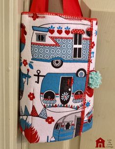 a purse hanging on the door handle of a house with a camper and hearts