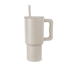 a white cup with a straw in it