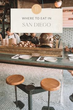 there is a sign that says where to eat in san diego on the counter at this restaurant