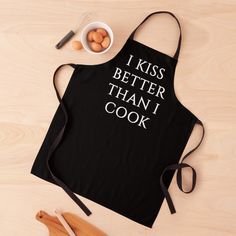 a black apron that says father the man the myth the legend on it next to eggs and utensils