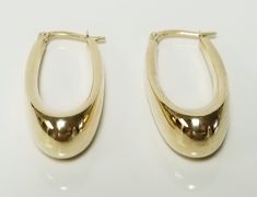 Thanks for shopping our vintage estate store. We tend to sell well below wholesale and truly hope you enjoy all of our items. Many of the items are one of a kind, so please enjoy scrolling through the pictures and hopefully something will catch your eye. Brown spots are from camera or reflections. Beautiful estate 10k yellow gold large dangle tear drop style hoop earrings. Tubes are hollow, but nice as you can see by the weight. Length: 1.25" Width: 15/8" Thickness: 8mm 3/8" Weight: 2.52 grams Beautiful hoops. Marked 10k, some that you will love. As with most estate items there may be some wear on item. We do not sell new items, nor do we charge new retail prices. Vintage Oval Earrings With Polished Finish, Classic Oval Earrings For Collectors, Classic Oval Earrings, Vintage 14k Gold Earrings With Polished Finish, Classic 14k Gold Earrings, Vintage Round Hoop Earrings For Formal Occasions, Hoops Earrings, Brown Spots, Jewelry Earrings Hoops