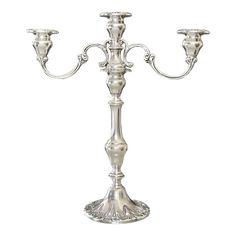 a silver candelabra with three candles on it