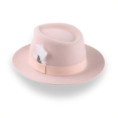 Description Materials Craftsmanship Hat Care Shipping Returns Product Description A Unique Light Pink Fedora Hat Step up your fashion game with The Clubber, a light pink fedora hat meticulously crafted from premium rabbit fur felt. This hat's smooth finish and 4 1/2" crown height offer a sleek and sophisticated look, while the 2 1/4" raw-edge upturned brim adds a unique touch of flair. The grosgrain ribbon hatband perfectly complements its stylish design, making it a standout accessory. Custom-m Pink Fedora Hat, Pink Fedora, Homburg Hat, Outdoor Hut, Mens Hats Fashion, Fedora Hat Men, Homburg, Chapeau Cowboy, Trilby Hat