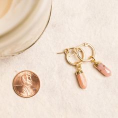 Pink Opal Point Earrings - Dangle Spike Shaped Genuine Opal Gemstones - 14k Gold Filled Hoops Handmade Jewelry gifts for her, mom, wife, bff Gemstones: 16x5mm approximately Bezel: Vermeil Gold (14k Gold over Sterling Silver) Hoops Material: 14K Gold Filled Hoop Diameter: 13mm Hoop Width: 2mm Gemstone: Genuine Pink Opal Closure: FlexCatch Note that due to the handmade nature of these genuine stones, measurements are approximately and might vary slightly for each stone. Made in the USA. Jewelry Ca Gemstone Dangle Huggie Earrings Gift, Small Hoop Gemstone Earrings For Gift, Dainty Gemstone Huggie Earrings For Gift, Dainty Gemstone Huggie Earrings As Gifts, Birthstone Huggie Jewelry Gift, Birthstone Crystal Earrings Gift, Usa Jewelry, Gold Filled Hoops, Handmade Jewelry Gift