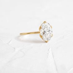 Oval cut focal diamond of your choice. Need help choosing a diamond? Our Customer Care team is right here. This design features an open basket setting with six triple-prongs on a delicate 1.2mm band—available in platinum or 14k solid yellow, white or rose gold. We handcraft each piece with responsibly sourced 14k gold and ethically sourced stones. Unique Prong Engagement Ring, Dainty Gold Band, Diamond Tattoos, Diamond Pendant Sets, Diamond Mangalsutra, White Blouses, Basket Setting, Diamond Necklace Set, Necklace Chain Lengths