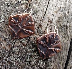 Copper Wildflower Flower Earrings. Handcrafted from recycled copper and sterling silver ear wires. Copper floral pieces are 1 inch tall. They have been oxidized and polished. I have treated them with wax to help preserve the patina. Total drop length of these mixed metal earrings is 1 and 1/2 inch. **Please check my shop policies before ordering to see important information on turnaround times, shipping methods and returns : http://www.etsy.com/shop/KDemARTe/policy?ref=shopinfo_policies_leftnav Nature-inspired Copper Earrings As Gift, Nickel-free Copper Flower Drop Earrings, Nature-inspired Silver Copper Earrings, Rustic Bronze Patina Earrings, Unique Copper Earrings With Patina, Nature-inspired Copper Dangle Earrings, Plant Earrings, Mixed Metal Earrings, Spring Jewelry