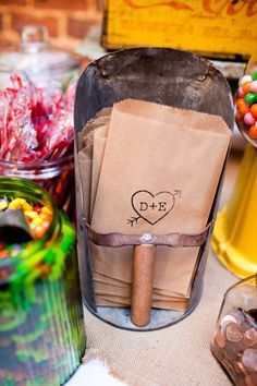 a table topped with lots of candies and bags filled with different types of candy