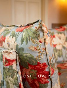 a close up of a floral couch with the words dose cover on it's side