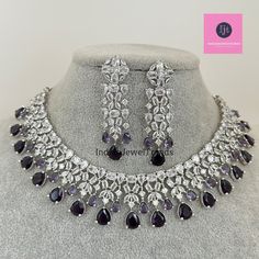 Purple CZ diamond bridal necklace, American Diamond wedding necklace, Cz jewelry, Indian, Pakistani, Punjabi wedding jewelry Regular Size And Adjustable with rhodium finish Ships from California, USA Delivery in 2-5 business days in the USA. Other colors can be found here https://www.etsy.com/listing/1423097794/sapphire-cz-diamond-bridal-necklace?ref=listings_manager_grid https://www.etsy.com/listing/1423095388/emerald-cz-diamond-bridal-necklace?ref=listings_manager_grid Color, shades, and texture displayed may slightly vary from the actual product due to digital image limitations. We request you consider these minor variations. Please expect the possibility of some slight imperfections when buying handmade jewelry. Please let me know if you have any questions. Arrives in a gift box. Thank Silver Round Kundan Necklace With Elegant Design, Silver Kundan Necklace With Elegant Round Design, Silver Kundan Necklace For Reception With Elegant Design, Silver Cubic Zirconia Kundan Necklace For Wedding, Wedding Silver Cubic Zirconia Kundan Necklace, Dazzling Silver Kundan Necklace With American Diamond, Silver Kundan Necklace With Elegant Cubic Zirconia Design, Formal Silver Kundan Necklace With American Diamond, Silver Kundan Necklace For Wedding With Elegant Design