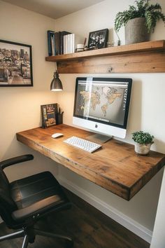 a wooden desk with a computer on it