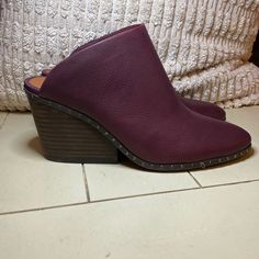 Lucky Brand Studded Wedge Clogs Size 7.5m Burgundy Maroon Leather Brand New Casual Leather Wedge Sandals With Pointed Toe, Fall Synthetic Mules With Stacked Heel, Faux Leather Mules With Stacked Heel Slip-on, Faux Leather Mules With Stacked Heel, Casual Closed Toe Mules With 4-inch Heel, Leather Wedge Mules With 4-inch Heel, Casual Mules With 4-inch Heel And Round Toe, Leather Mules With Stacked Wedge Heel, Synthetic Clogs With Leather Footbed And Wedge Heel