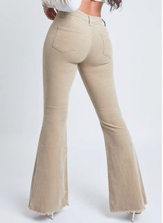 Step up your vintage style in our Junior High Rise Corduroy Flare Pant. These flared pants feature a textured corduroy feel and a bell-bottom silhouette. Designed slim in the hips and thighs, with a high-rise waist and a seam behind the knee for an extra flattering fit. Detailed with a frayed hem to spice things up! We love these styled with a band tee and sneakers for a trendy look or a sweater vest and booties.Product Details:- High-Rise- 1-Button Closure with Zipper- 2 Back Pockets- Belt Loops- Flare SilhouetteSize & Fit (based on size 5):- Inseam: 34"- Rise: 11"- Leg Opening: 26"- Model is wearing a size 3 Size & Fit (based on size 18)- Inseam: 33"- Rise: 12" - Leg Opening: 28"- Model is wearing a size 14 Machine wash cold, inside out. Tumble dry low. 98% Cotton/ 2% Spandex Flare Pant, Black 13, Junior High, Flared Pants, Band Tees, Flare Pants, Sweater Vest, Step Up, Bell Bottoms