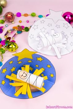 a paper plate with a rocket on it next to other crafts and decorations for kids