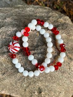 This bracelet is made with red faceted beads, white glass beads, daisy spacers and a candy cane bead. Note: Colors may vary depending on your monitor Shipping Info: All orders are shipped from Canada and they are sent through Canada Post.  If you would like expedited/faster shipping, it will cost more and you can reach out to me directly and I will give you pricing. Within Canada: Sent regular mail with no tracking and it can take 5-10 business days to arrive. United States: Sent with tracking a Adjustable White Stretch Bracelet For Holidays, White Crystal Bracelet With Colorful Round Beads, White Round Bead Bracelets For Holiday, White Stretch Bracelet With Faceted Beads For Gift, White Christmas Jewelry With Colorful Beads, White Christmas Bracelets With Colorful Beads, Christmas White Bracelets With Colorful Beads, White Bracelets With Colorful Beads For Christmas, Holiday White Beaded Stretch Bracelet