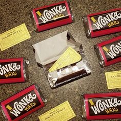 there are many different types of candy bars on the counter top, including one with a note attached to it