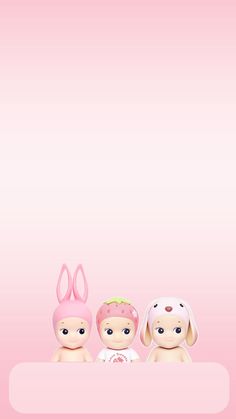 two little babies with bunny ears sitting next to each other on a pink wallpaper