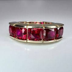 "This is a Ruby wedding band set in 14k solid gold. The radiant cut ruby stacking anniversary band is July birthstone. The simple women's wedding half eternity band makes a great birthday, promise anniversary ring. This ring pictured is lab created red ruby #7859 This ring can be made with many different stone colors Message us for pricing on different color/type stones -Approximate total carat weight: 3.00ctw diamond equivalent -Stone Size: 5x5mm - approx. 0.60ct each diamond equivalent -Stone Ruby Wedding Band, Ruby Rings, Ruby Wedding, Half Eternity Band, Ruby Necklace, Yellow Gold Setting, Ring Pictures, Star Ruby, Ruby Stone