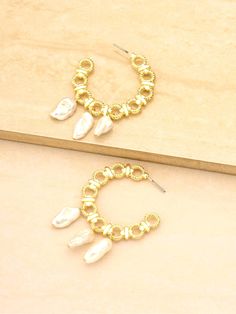 Buy Ettika: Golden Hoop Earrings (E3217-PRL-G-710) and more at Swimwear World. FREE SHIPPING US and Canada. Ship worldwide. Golden Hoop Earrings, Golden Hoops, Charm Bracelet, Hoop Earrings, Free Shipping