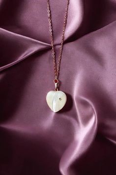 💖 Elevate your style with this stunning mother of pearl heart necklace! Featuring a 50cm adjustable chain and delicate sparkling details, this piece brings an elegant touch of shimmer to any outfit. The mini heart charm, crafted from mother of pearl, offers timeless beauty and sophistication. Perfect for both everyday wear and special occasions. Plus, it comes with an extension chain for the perfect fit. LuxoticaBoutique brings you cool, original, and modern designs that blend classic and conte Pearl Heart Necklace, Pearl Heart, Mini Heart, Elegant Jewelry, Heart Charm, Heart Necklace, Timeless Beauty, Mother Of Pearl, Halloween Shopping