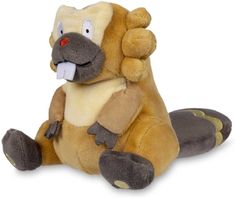 a stuffed animal is sitting on the ground with its mouth open and eyes wide open