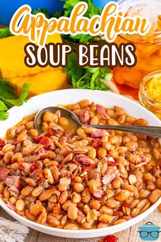 a white bowl filled with beans and ham